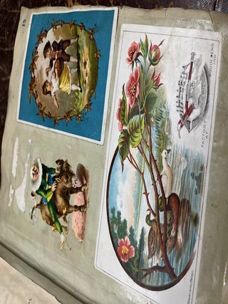 A "Mark Twain's Adhesive Scrap Book" given as a gift to Nettie (Annette Bush, Jackson, Michigan) from Emma M. Peake on May 17th, 1878 who has filled it with colorful advertising cards