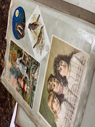 A "Mark Twain's Adhesive Scrap Book" given as a gift to Nettie (Annette Bush, Jackson, Michigan) from Emma M. Peake on May 17th, 1878 who has filled it with colorful advertising cards