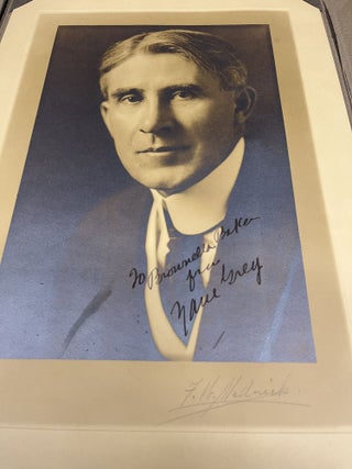 ORIGINAL SIGNED PHOTOGRAPH OF ZANE GREY AND INSCRIBED TO HIS SECRETARY BROWNELLA BAKER. Zane Grey.