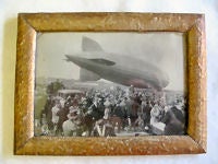 Item #95-1221 1930 LZ 127 framed presentation photo of a Zepplin landing. With reverse having a statement from the General Director (probably of the Zepplin Co.) with his stamped signature giving thanks to the people who helped make sure the landing was successful. A
